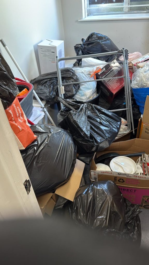 House clearance workers recycling old furniture